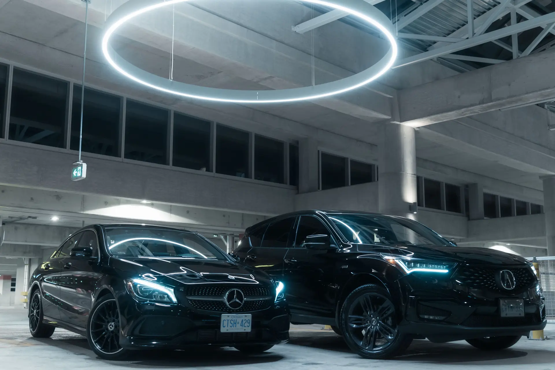 Premium luxury cars in a modern Toronto setting