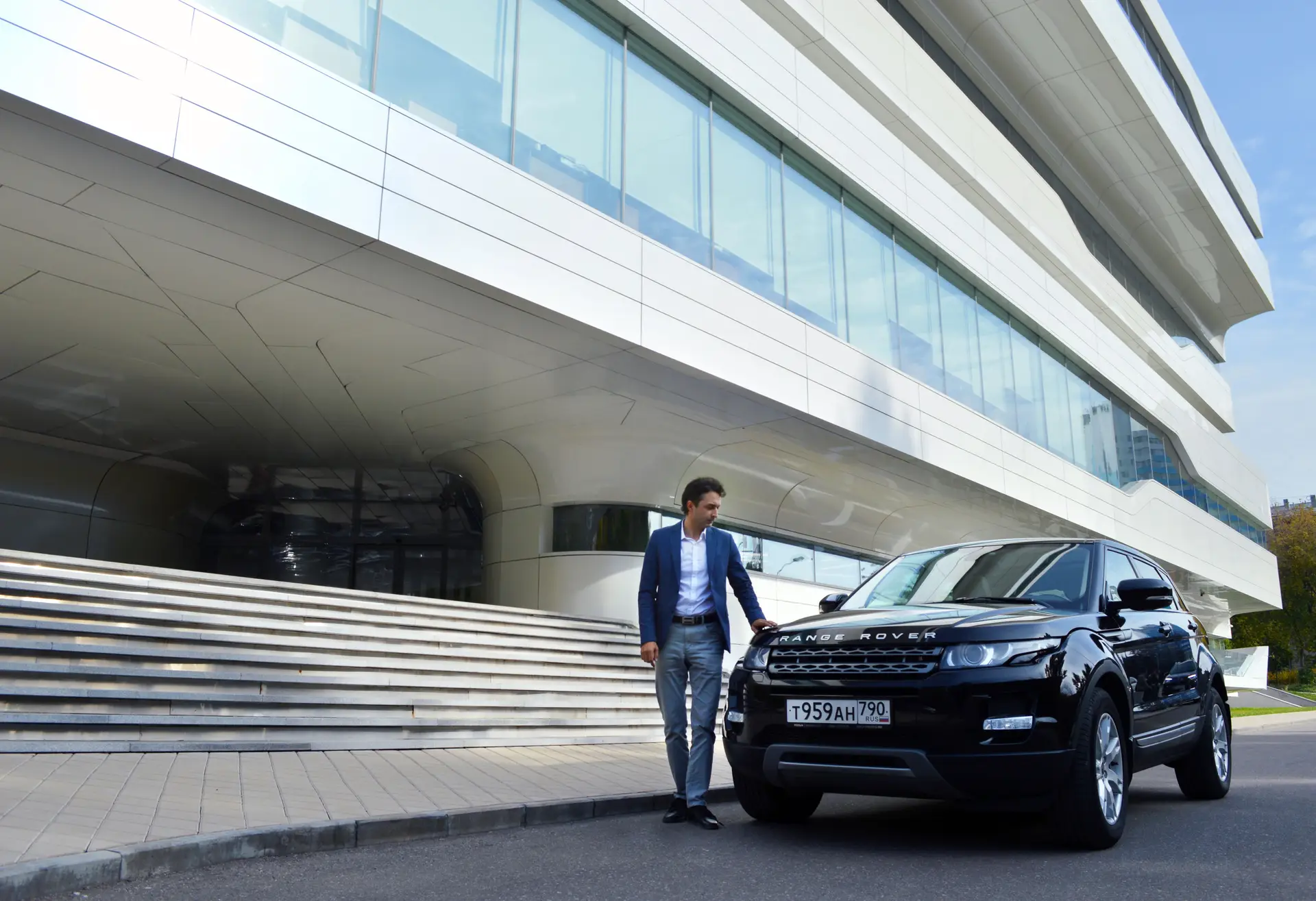 Business professional with rental car